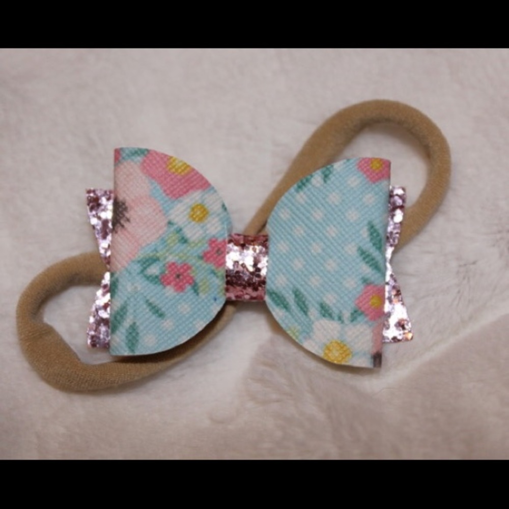 Pink floral hair bow on nylon